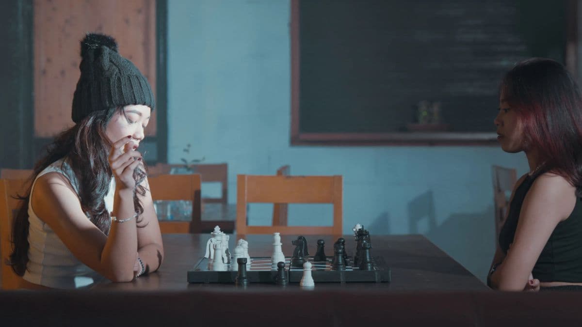 Two women playing chess