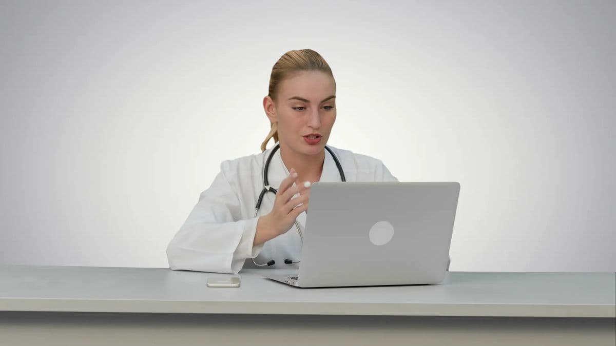A female doctor conducting a first telemedicine consultation on her laptop