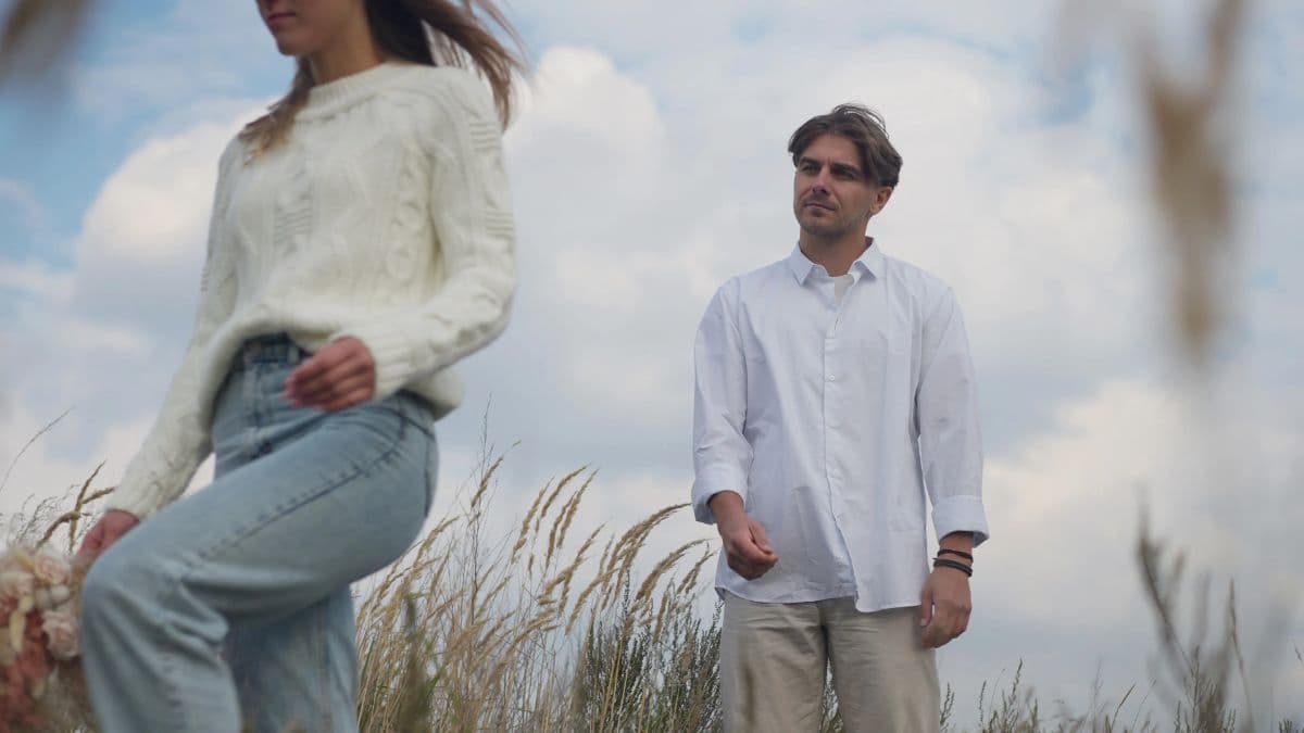 A man watching his woman walk away