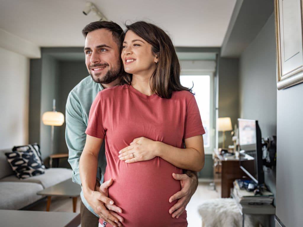 A man holding his pregnant wife
