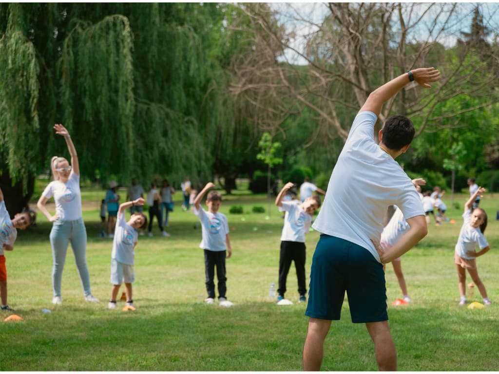 Family in park stretching and exercising