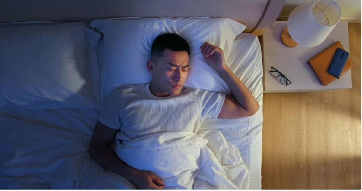 man struggling to sleep